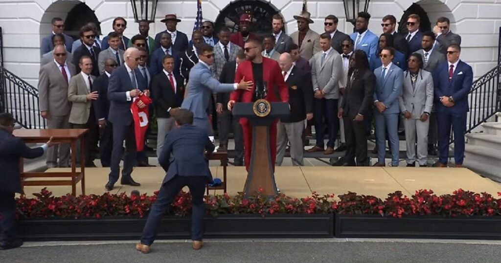 Travis Kelce, Chiefs Icon, Addresses Biden: 'Don't Move!' - The Podium Takeover Attempt!
